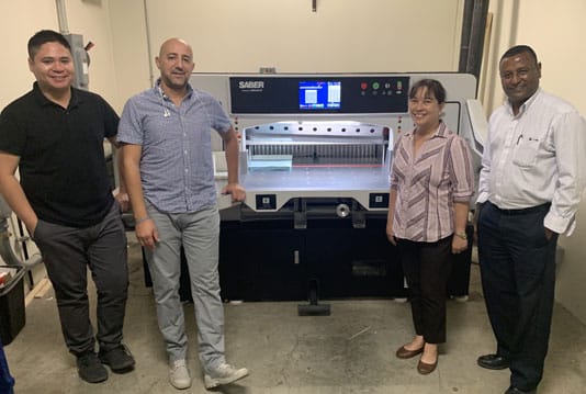 Alameda County Sheriff’s Office team members with their new 37-inch SABER X-15 paper cutter