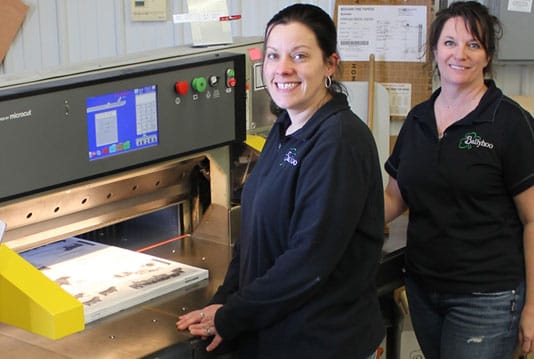 Ballyhoo Printing & Design owners with their Polar cutter and Microcut retrofit