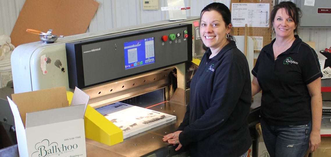 Ballyhoo Printing & Design owners with their Polar cutter and Microcut retrofit